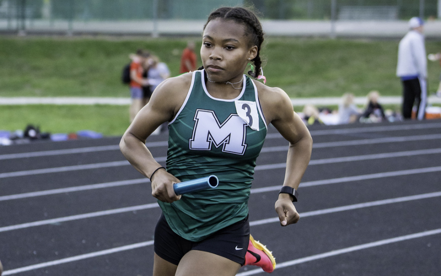 girl running with baton